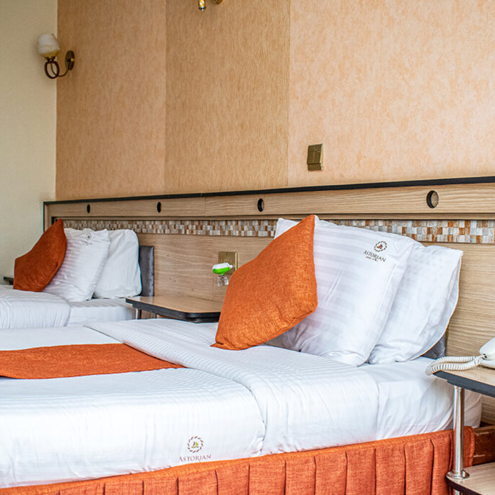 Experience the ultimate in luxury and comfort at the Astorian Grand Hotel Naivasha. Our Deluxe Twin Room features two plush twin beds, a spacious bathroom, and a range of amenities. Book now and enjoy unbeatable rates and stunning views of Naivasha!